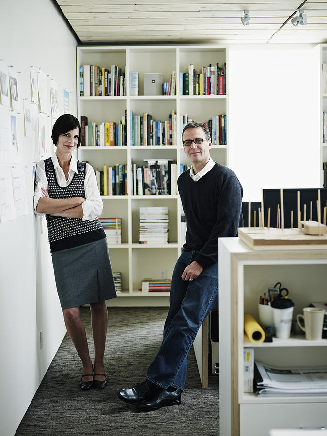 Husband and wife architect team in office portrait Photograph by Thomas Barwick