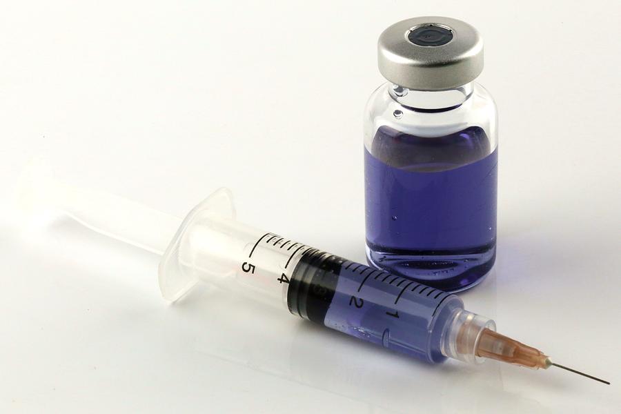 Hypodermic needle and Insulin Vial on a white background Photograph by Douglas Sacha