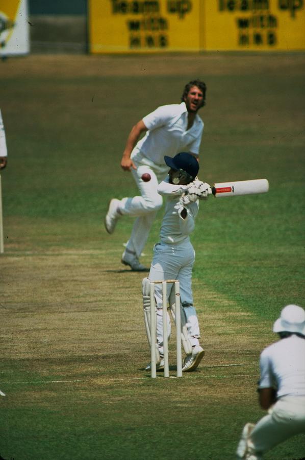 Ian Botham of England and Sidath Wettimuny of Sri Lanka Photograph by Adrian Murrell