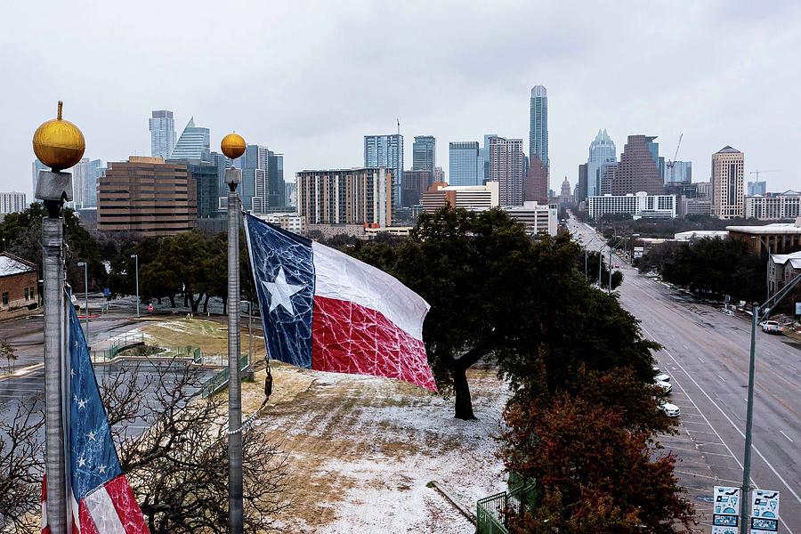 Ice-covered Texas Flag over South Congress Photograph by Aaron E Martinez