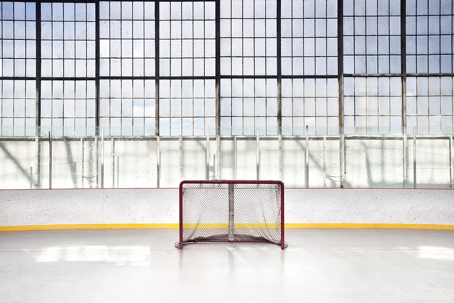 Ice hockey net in an arena Photograph by Pgiam