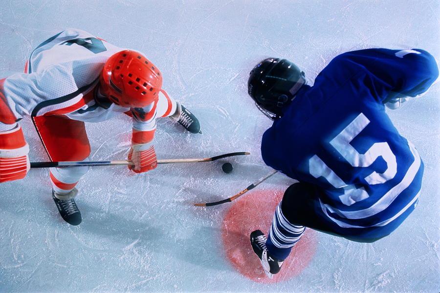 Ice hockey, players in face-off Photograph by David Madison