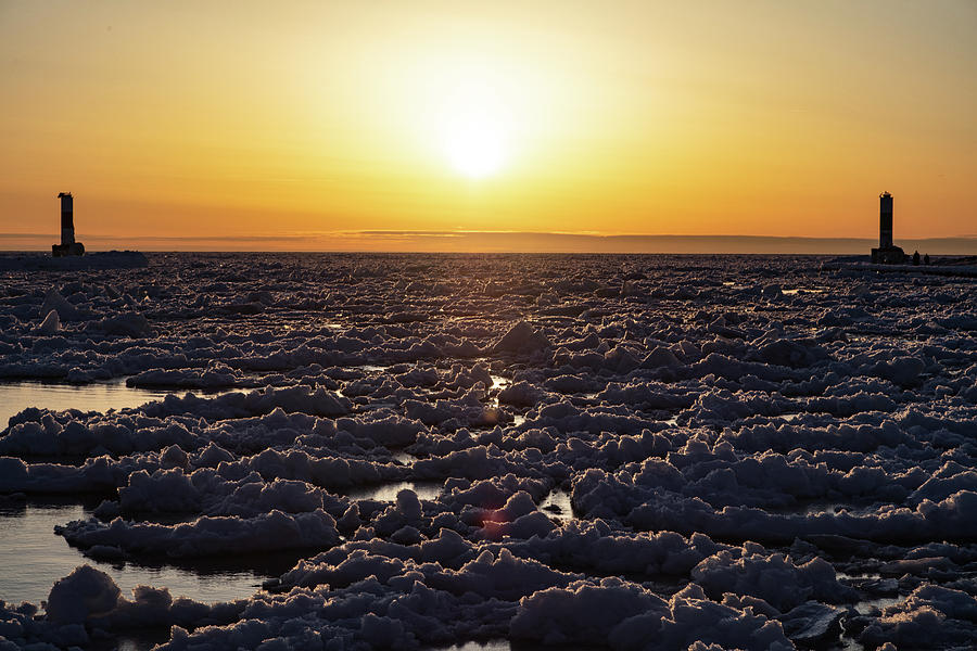 Ice on Lake Michigan at sunset in Holland Michigan Photograph by Eldon McGraw