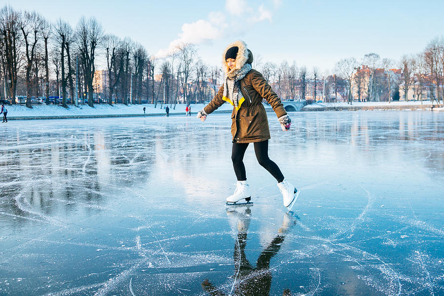 Ice skating on the frozen lake Photograph by Andrey Danilovich