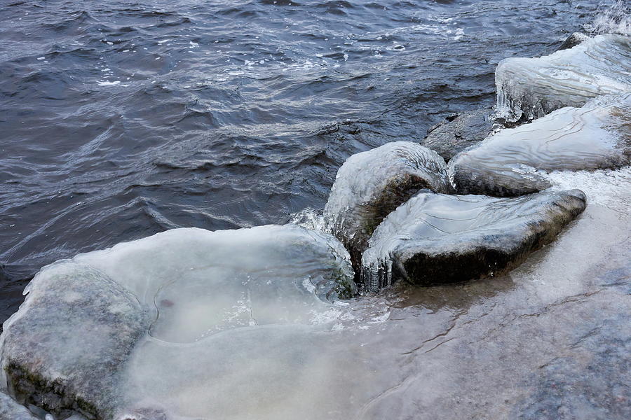 Ice water and rocks Photograph by Jouko Lehto