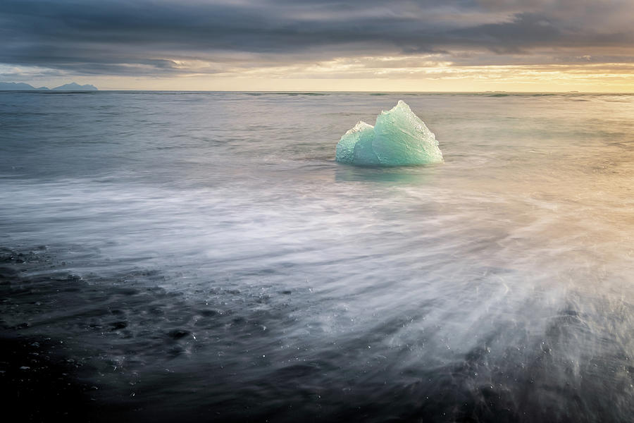 Iceberg at Diamond Beach in Iceland at sunrise Photograph by Alexios Ntounas