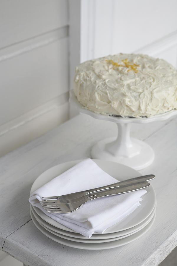 Iced cake with plates Photograph by Heidi Coppock-Beard