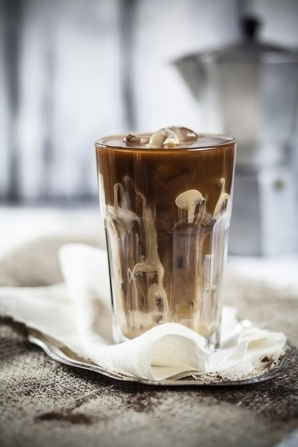Iced coffee with sweet condensed milk Photograph by Westend61
