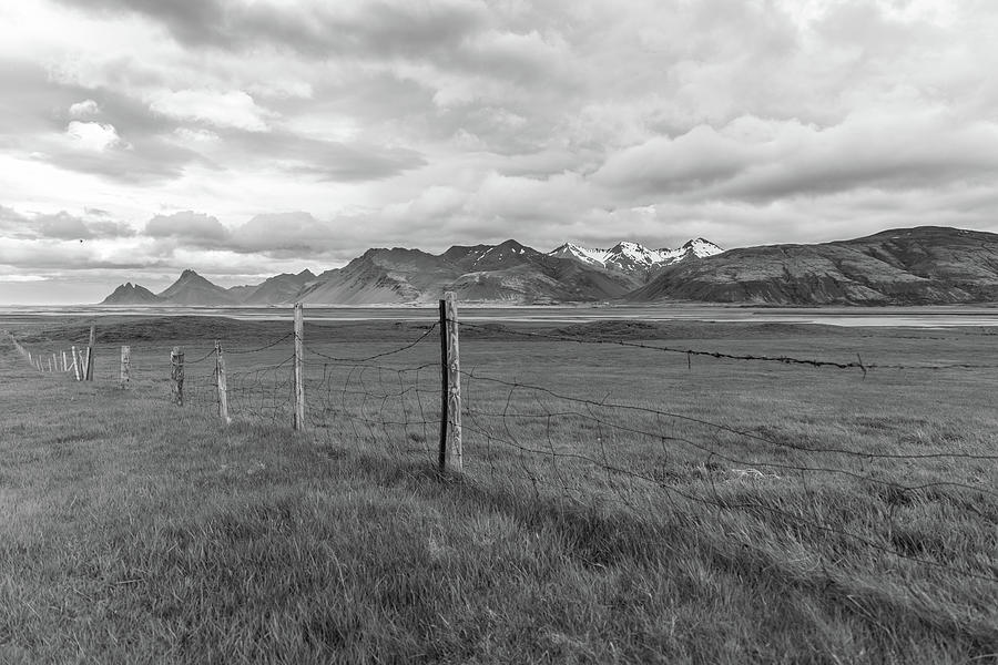 Iceland Fence line Black and White  Photograph by John McGraw