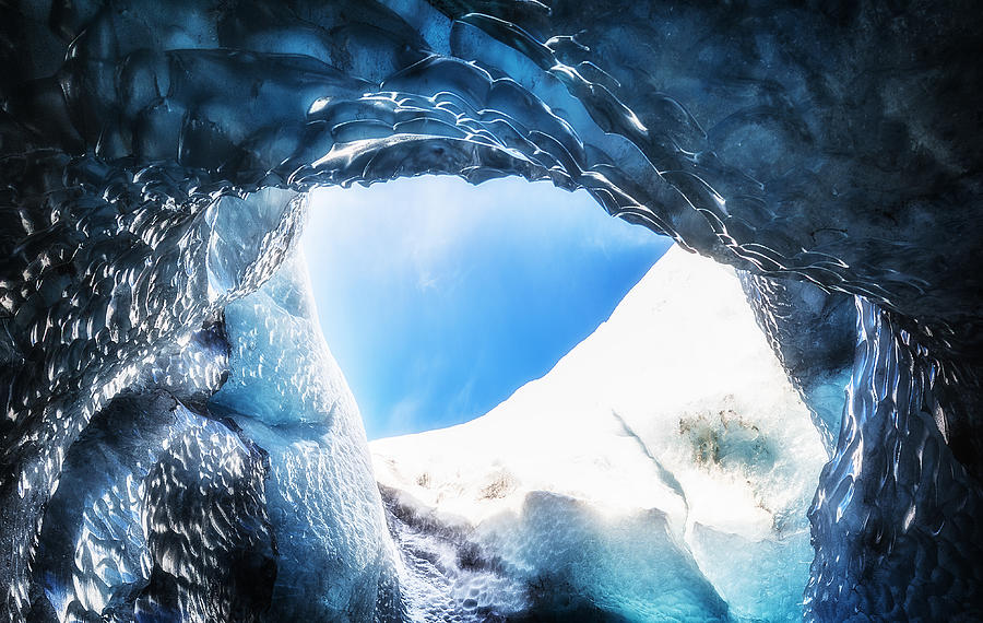 Iceland Ice cave Vatnajokull hole and clear blue sky Photograph by ImpossiAble