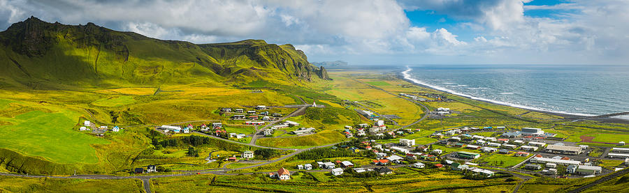 Iceland picturesque town of Vik between mountains and Arctic Ocean Photograph by fotoVoyager