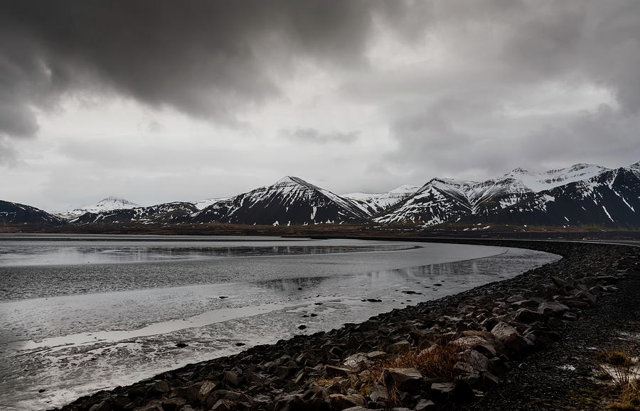 Icelandic landscape with frozen lake and mountains covered in snow in Iceland Photograph by Michalakis Ppalis