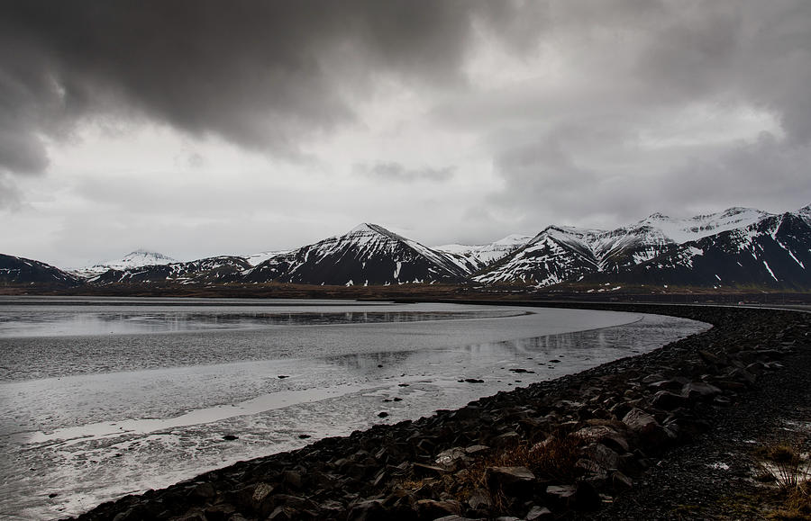 Icelandic  landscape with frozen lake and mountains covered in snow Photograph by Michalakis Ppalis