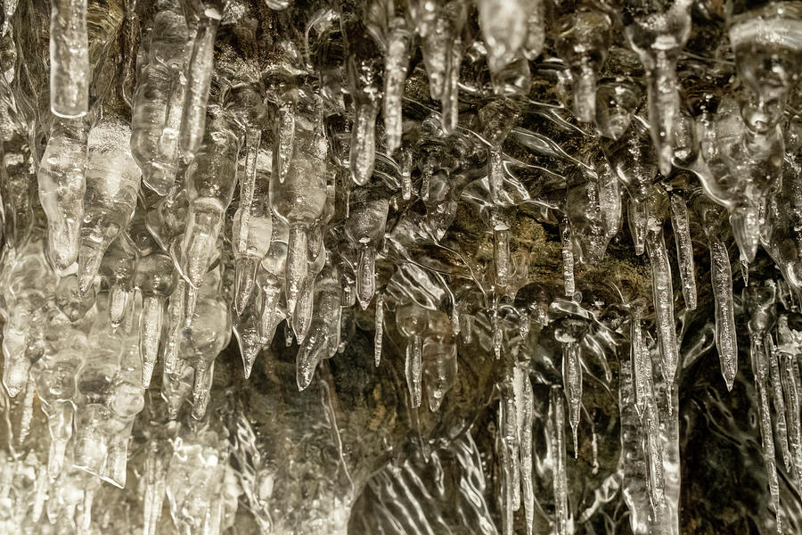 Icicles in cave on Baikal lake Photograph by Mikhail Kokhanchikov