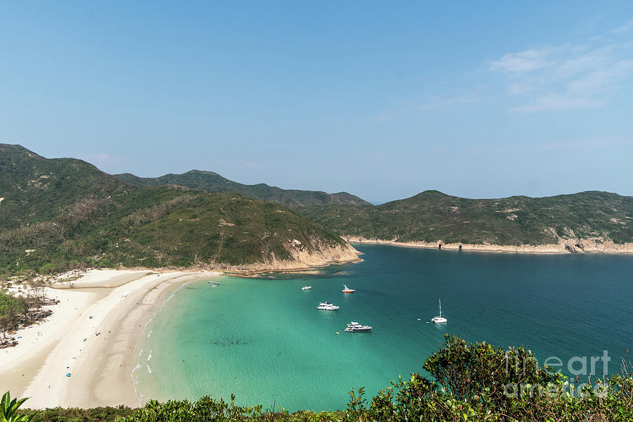Idyllic view of the beach and sailboats in the Sai Kung peninsul Photograph by Didier Marti