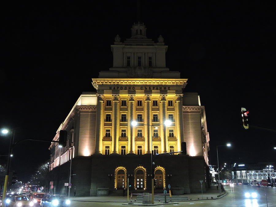 Illuminated building at the crossroads of several avenues Photograph by ...