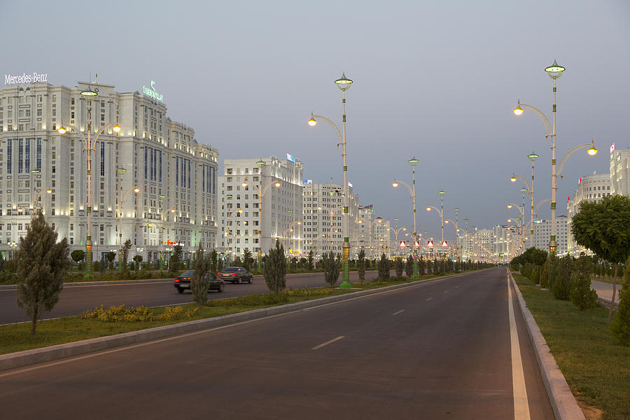 Illuminated buildings, Ashgabat, Turkmenistan Photograph by Laurie Noble