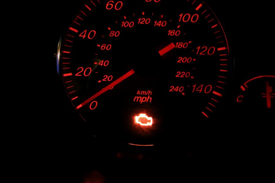 Illuminated check engine light displayed on a vehicle dashboard Photograph by Douglas Sacha