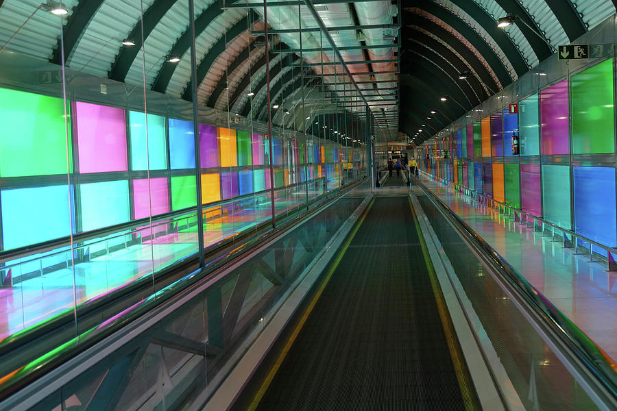 Illuminated walkway between terminals of the air Photograph by Steve Estvanik