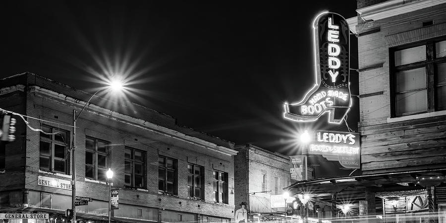 Illuminating The Stockyards Cityscape And Cowboy Boot Neon - Black And White Panorama Photograph by Gregory Ballos