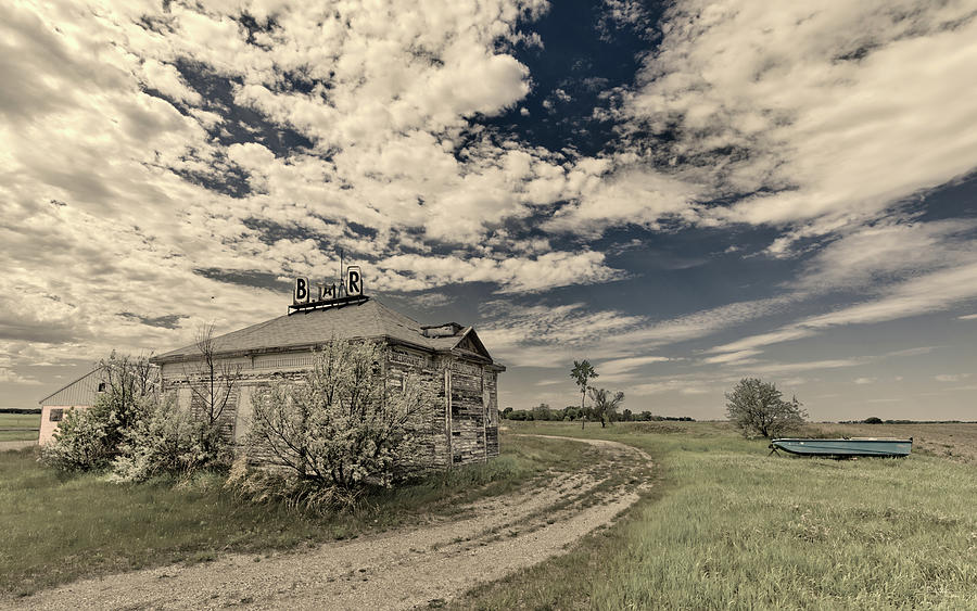 Im Boating to the Bar for a Drink -  abandoned schoolhouse turned bar near Oriska ND Photograph by Peter Herman