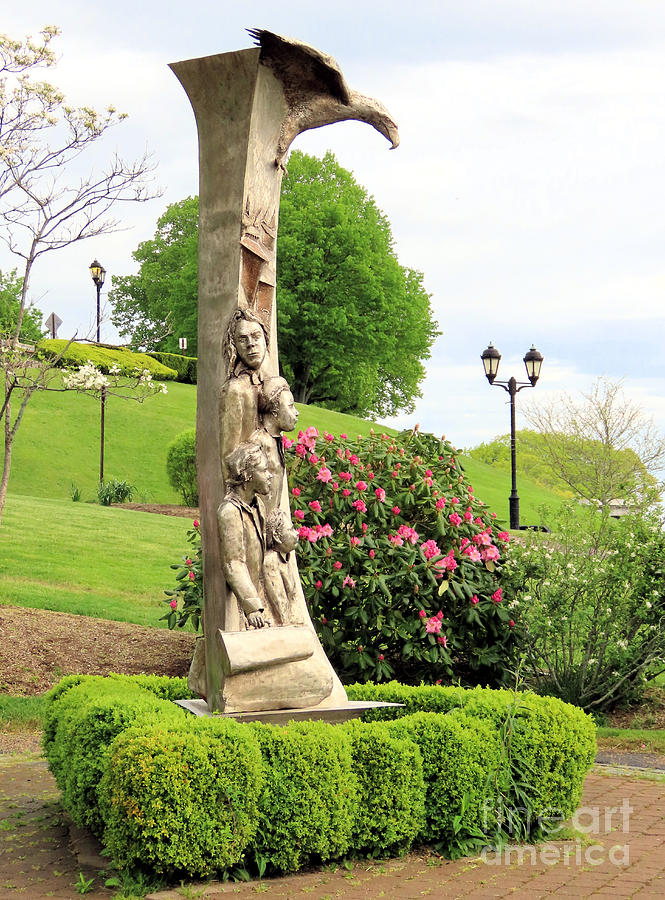 Immigrant statue in Spring Photograph by Janice Drew