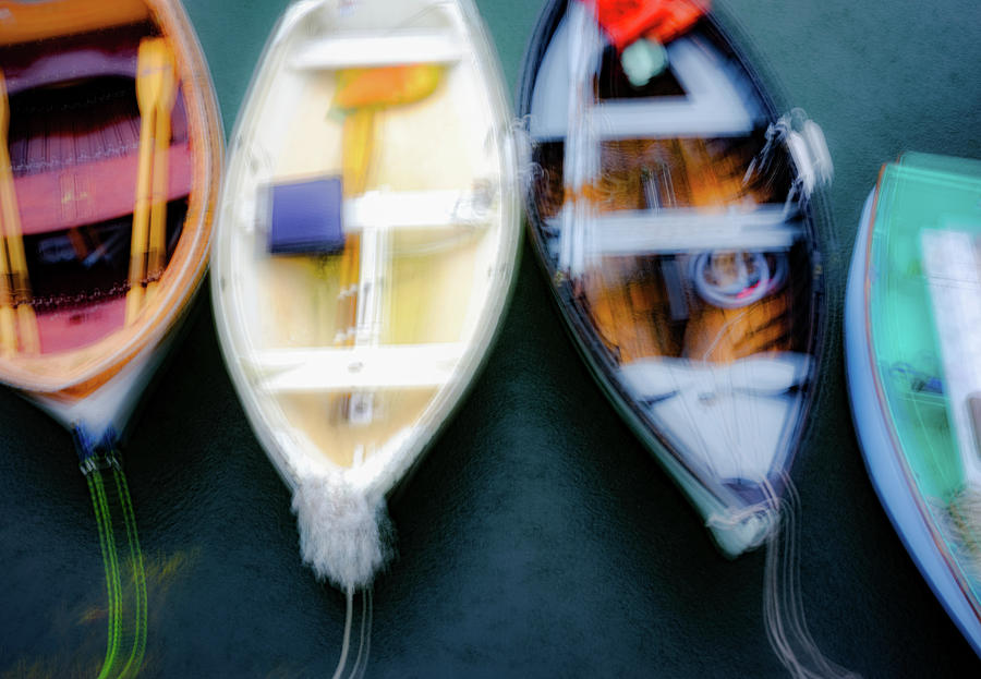 Impressionistic image of colorful row boats in the rain Photograph by