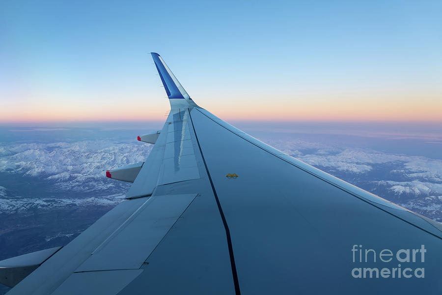 In flight, plane wing view Photograph by Delphimages Photo Creations