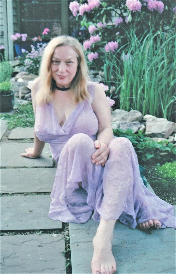 Garden Photograph - In Her Garden by Jerry Hanks