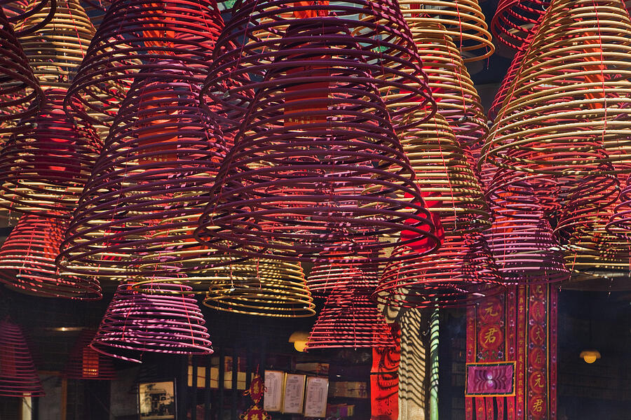 Incense coils hanging from ceiling Photograph by Gary Conner