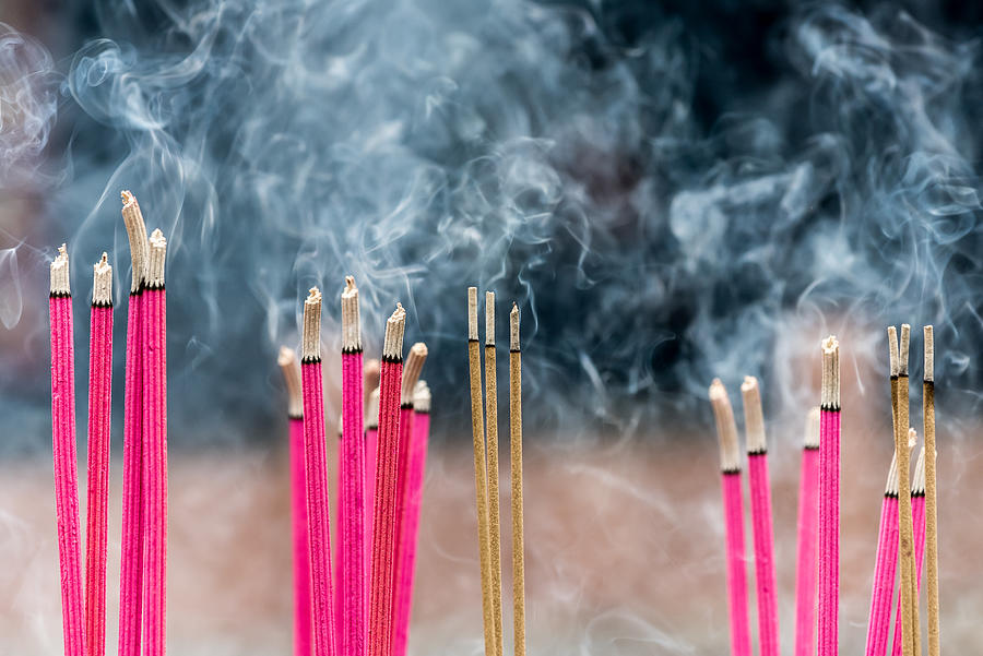 Incense sticks burning with smoke in a buddhist temple in China Photograph by © Philippe LEJEANVRE
