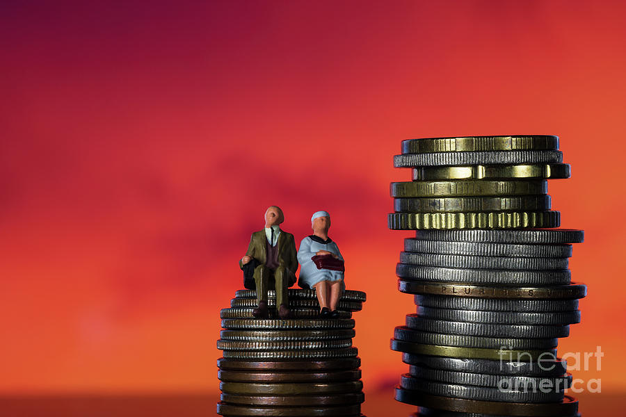 Income Tax Campaign Spain. Old Couple sitting on coin stack.. Declaracion de la Renta. Macro Photograph by Pablo Avanzini