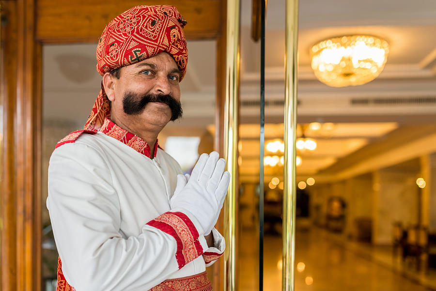 Indian Concierge Welcome Guest at Hotel Entrance India Photograph by Mlenny