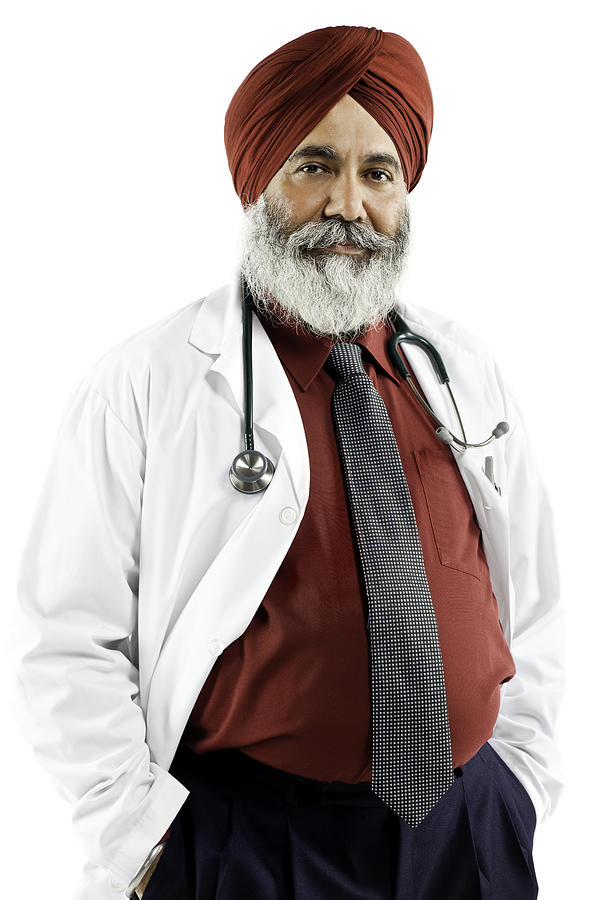 Indian Doctor Wearing a Turban - Isolated Photograph by Ranplett