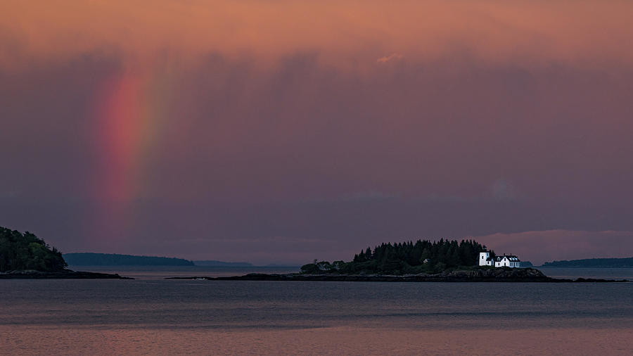 Indian Island Lighthouse at sunset with short rainbow Photograph by Travel Quest Photography