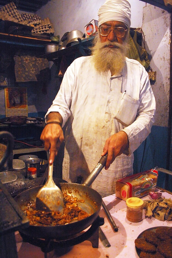 Indian Sikh Man cooking chicken tikka masala Photograph by Nav preet Amole