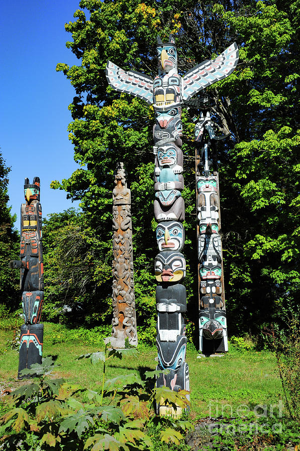 Indian tribal totem poles at Vancouvers Stanley Park. Photograph by Gunther Allen