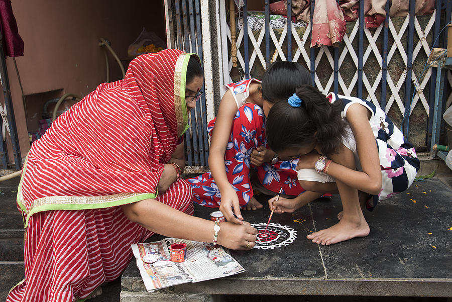 Indian Woman draw Rangoli. Photograph by CR Shelare
