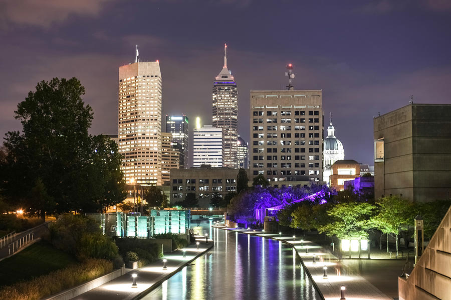 Indianapolis skyline illuminated at late dusk and reflected on White river canal in Indiana, USA Photograph by Sir Francis Canker Photography