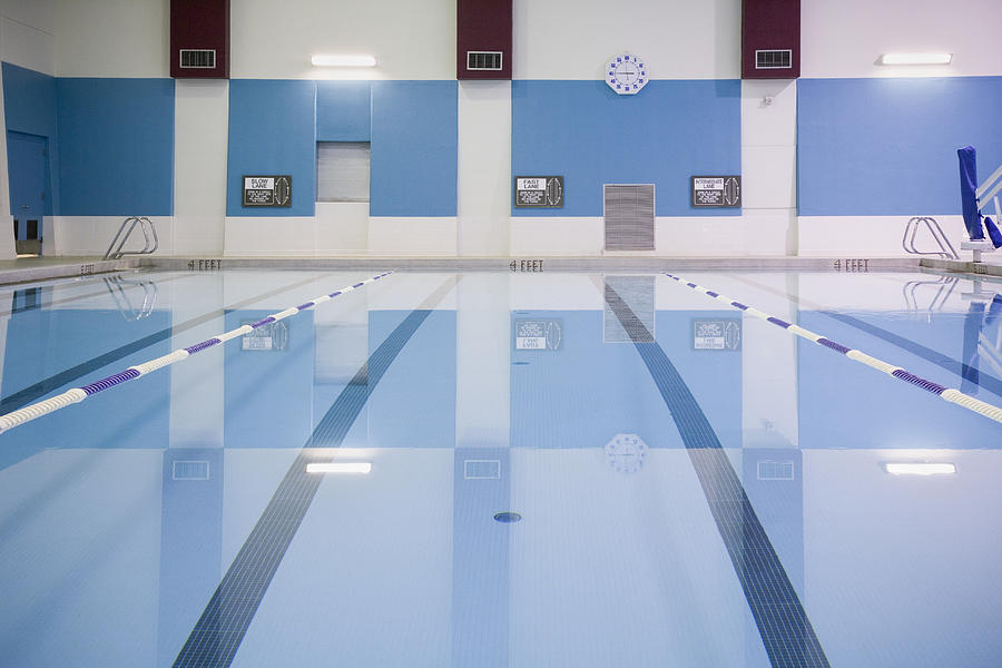 Indoor swimming pool with lane markers Photograph by Andersen Ross