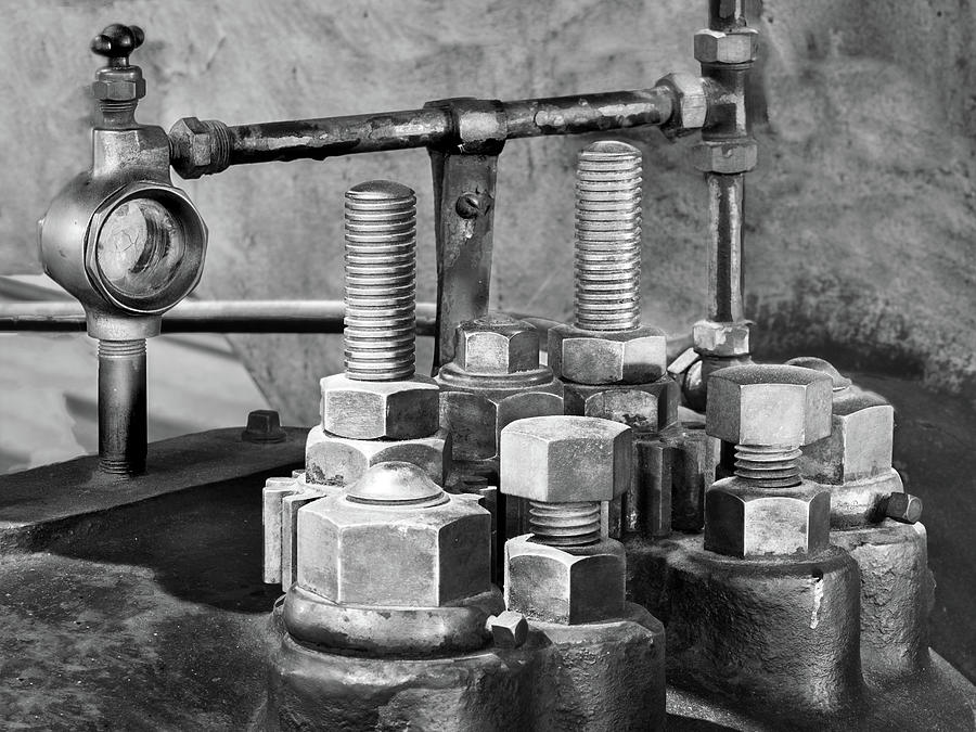 Black And White Photograph - Industrial Nuts, Bolts, and Meter by Betty Denise