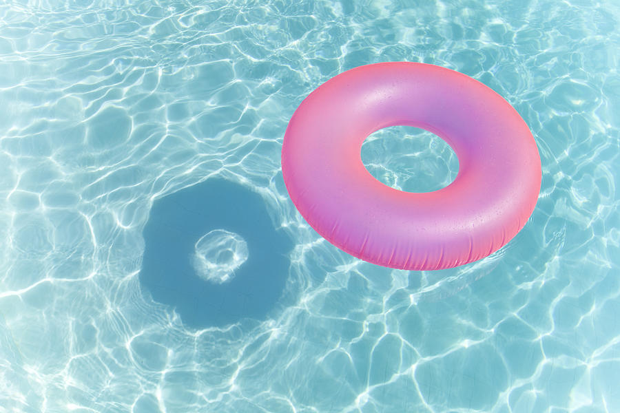 Inflatable Ring in Swimming Pool Photograph by Chris Collins