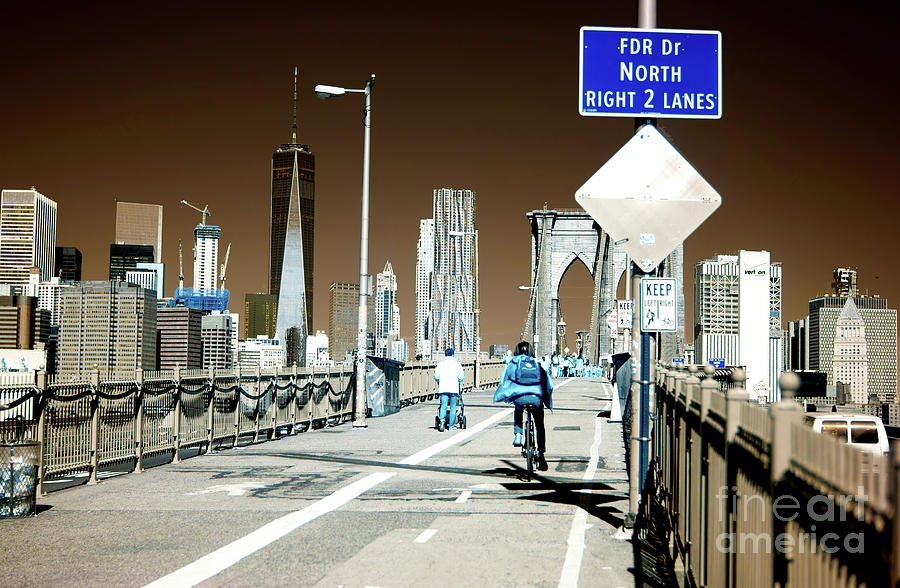 Infrared Biking the Brooklyn Bridge in New York City Photograph by John Rizzuto