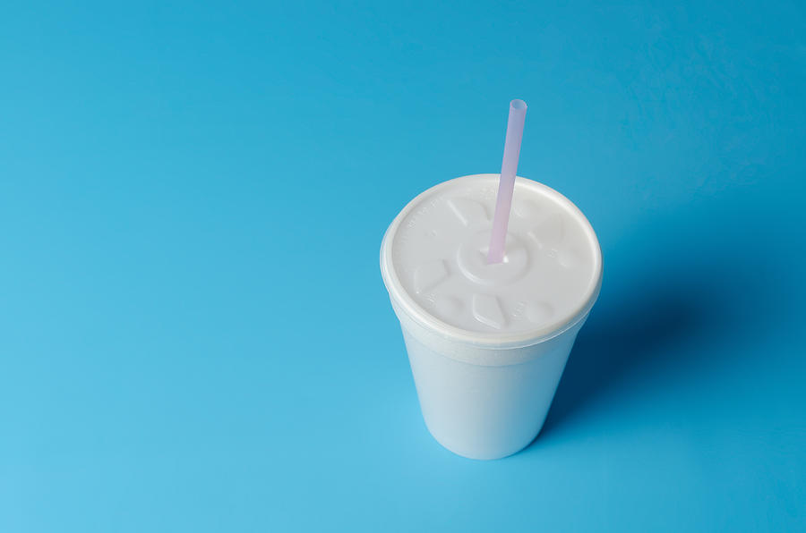 Insulated disposable plastic cup on blue background Photograph by Sandor Mejias Brito