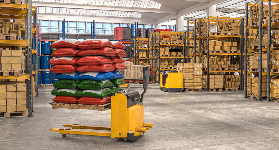 Interior Of A Storage Warehouse With Means For Moving Goods Photograph by Gualtiero Boffi
