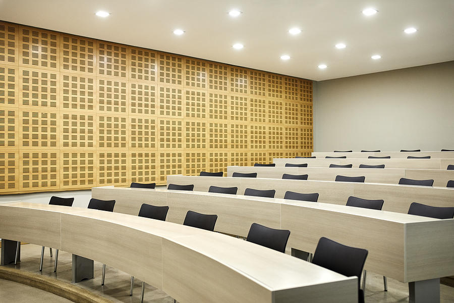 Interior of empty illuminated lecture hall Photograph by Morsa Images