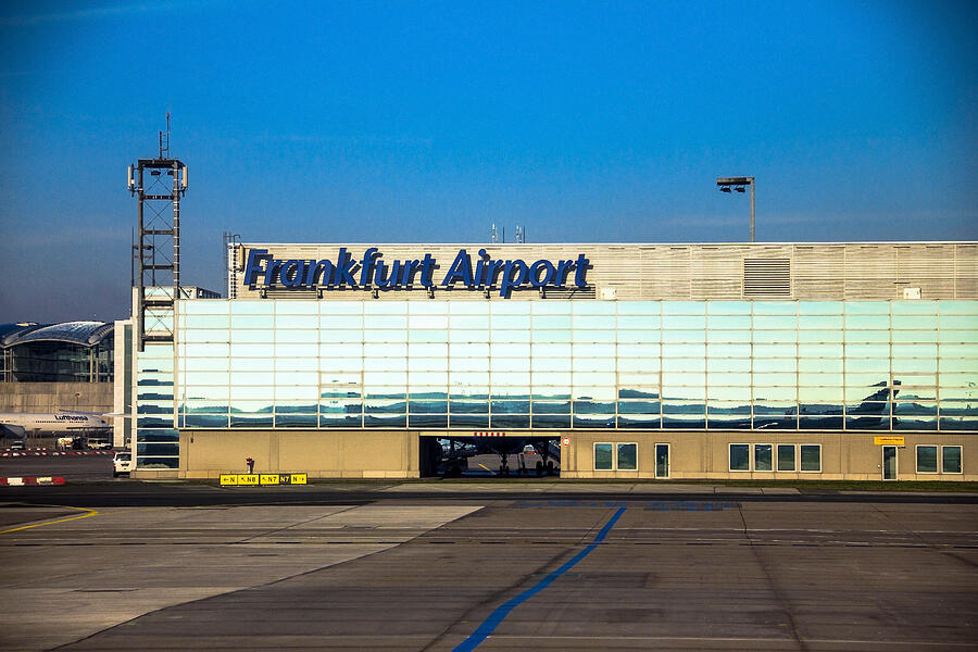 International Frankfurt Airport on blue winter sky background Photograph by Flik47
