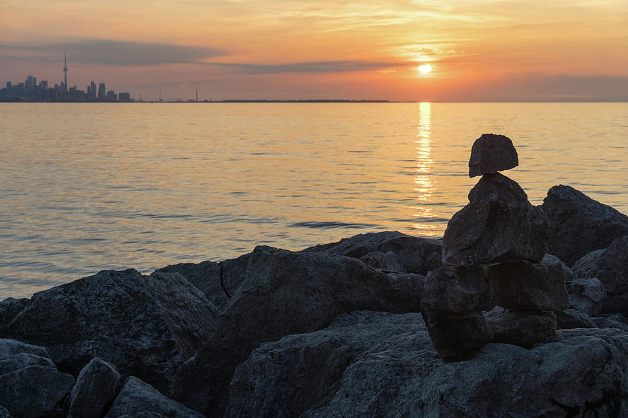 Inuksuk Sunrise - Rock Cairn Figure Greeting the Sun on Lake Ontario in Toronto Photograph by Georgia Mizuleva