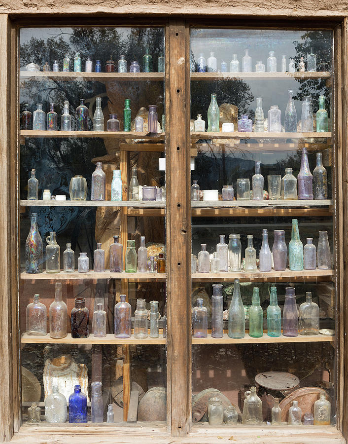 Iridescent Antique Bottle Collection  Photograph by Kathleen Bishop