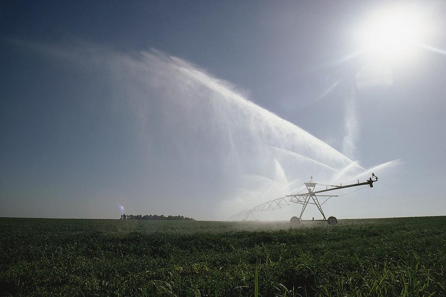 Irrigating a field Photograph by Scott Barrow